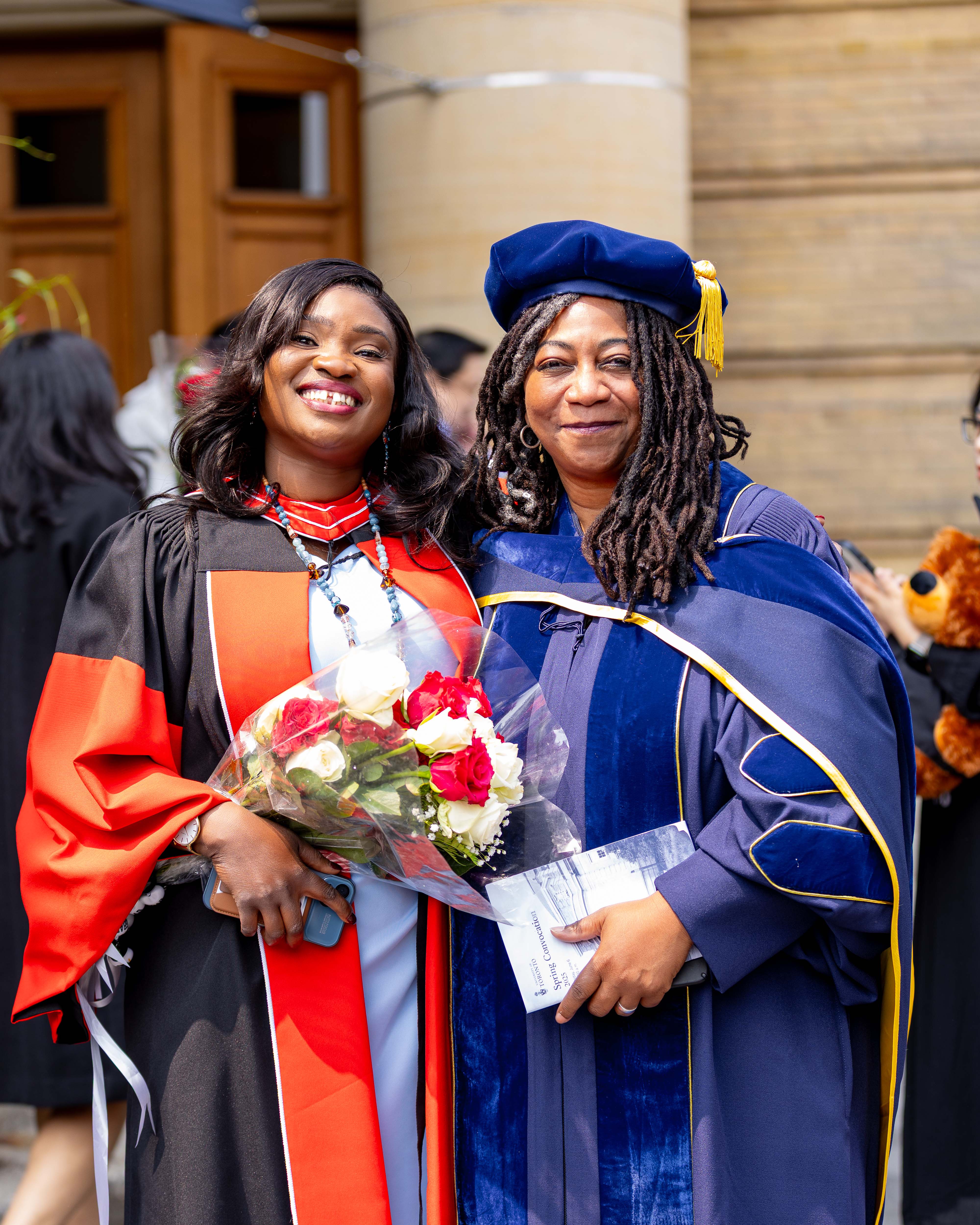 2025 06 06 Wumi Asubiaro Dada with supervisor Professor Kamari Clarke in front of Convocation Hall