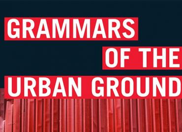 Words &amp;quot;grammars of the urban group&amp;quot; in front of red fence