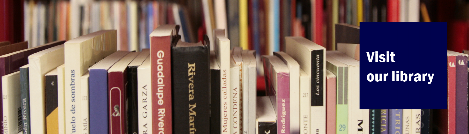 a row of book covers with a blue box on the right corner. On top of the blue box, the words "Visit our library" are written on white. 